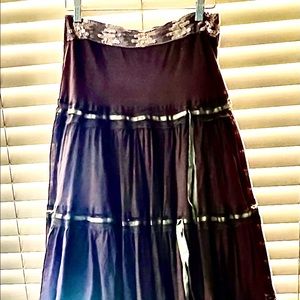 Brown cotton and lace w/ribbon and sequin waist.  Prairie, long skirt; lined.